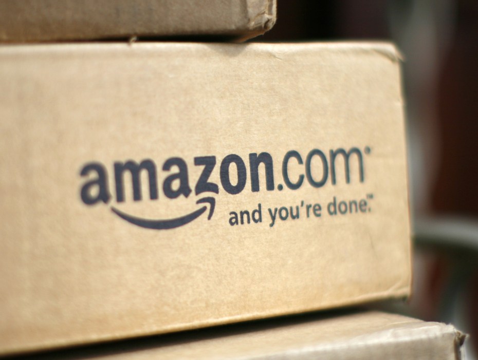 A box from Amazon.com is pictured on the porch of a house in Golden, Colorado July 23, 2008. Online retailer Amazon.com Inc said on Wednesday its quarterly profit doubled on a 41 percent rise in revenue, sending its shares up more than 6 percent.  REUTERS/Rick Wilking (UNITED STATES) - RTR20GKQ
