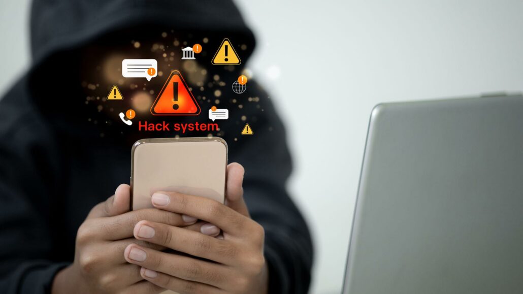 Cybercriminal targeting a smartphone through a hacking attack to steal personal and financial data